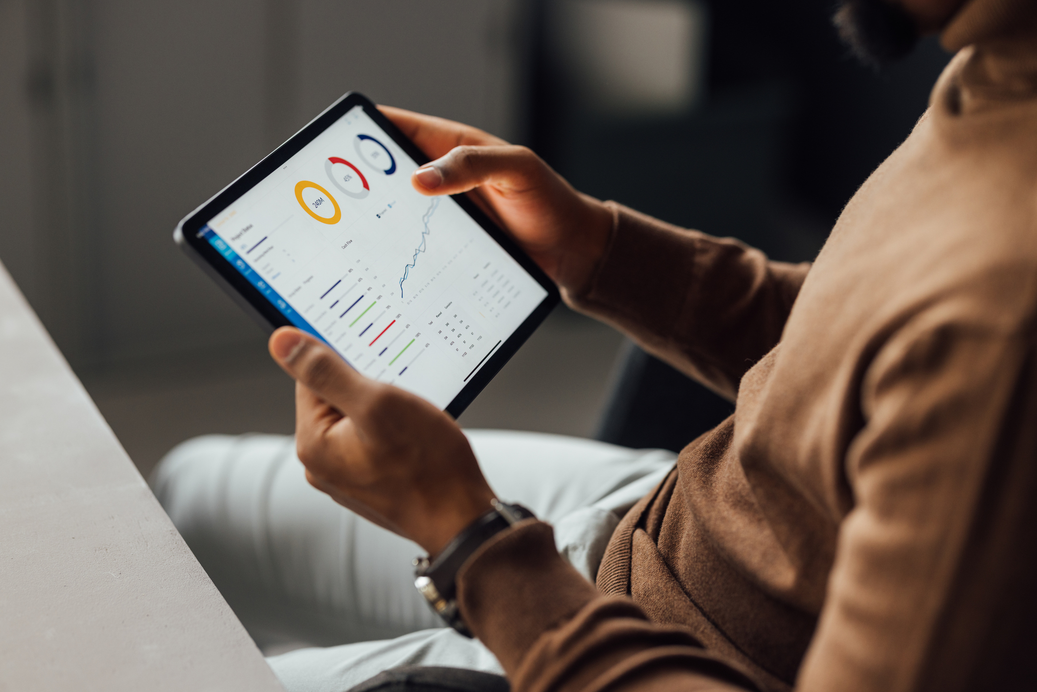 A customer views data from a Connectivity Management Platform on their tablet. 