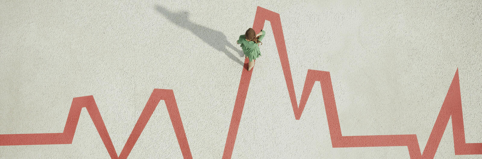 Woman_walking_on_painted_pulse_trace_graph
